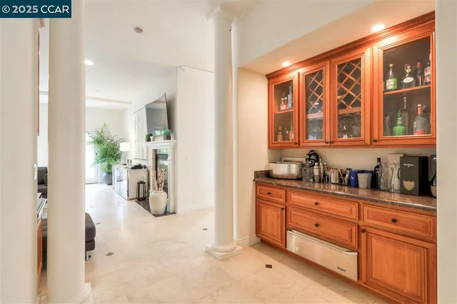 a kitchen with stainless steel appliances a refrigerator and cabinets