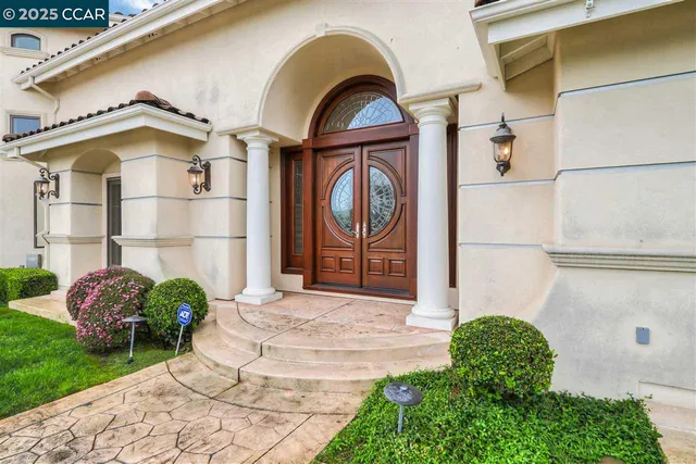 a front view of a house with garden