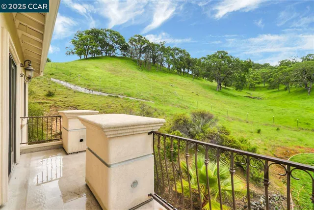 a view of a balcony with an outdoor space