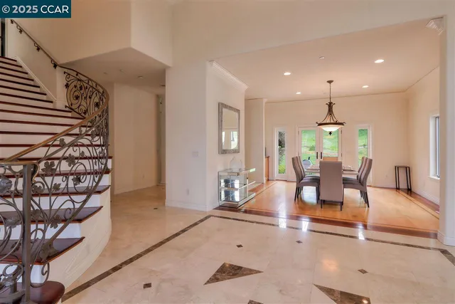 a view of a livingroom with furniture and a potted plant
