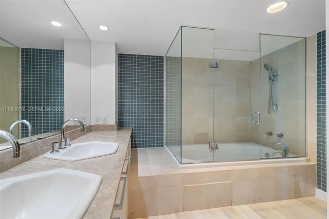 a bathroom with a toilet a sink and bathtub