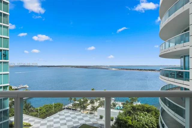 a view of a balcony and a floor to ceiling window
