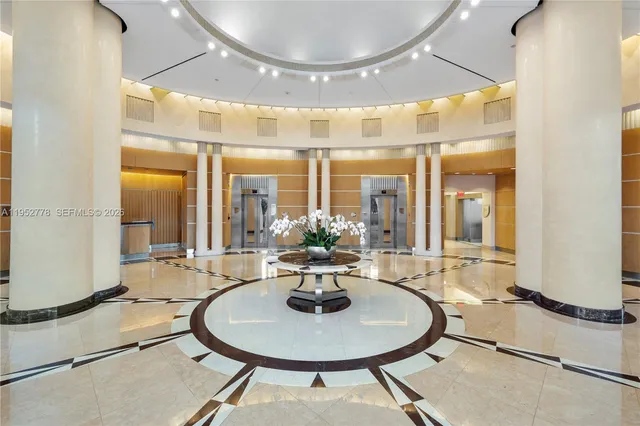 a dining room with table and chairs