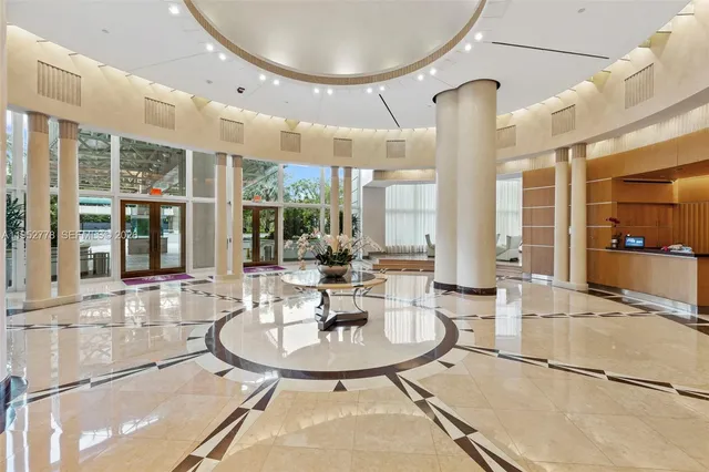 a view of a dining room with furniture wooden floor and a chandelier