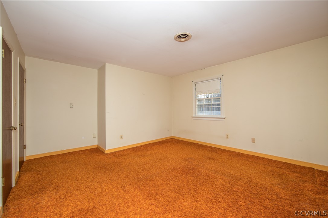 11271 Celtic Road Chesterfield, VA 23838 - Photo 17 of 26 an empty room with a windows and closet