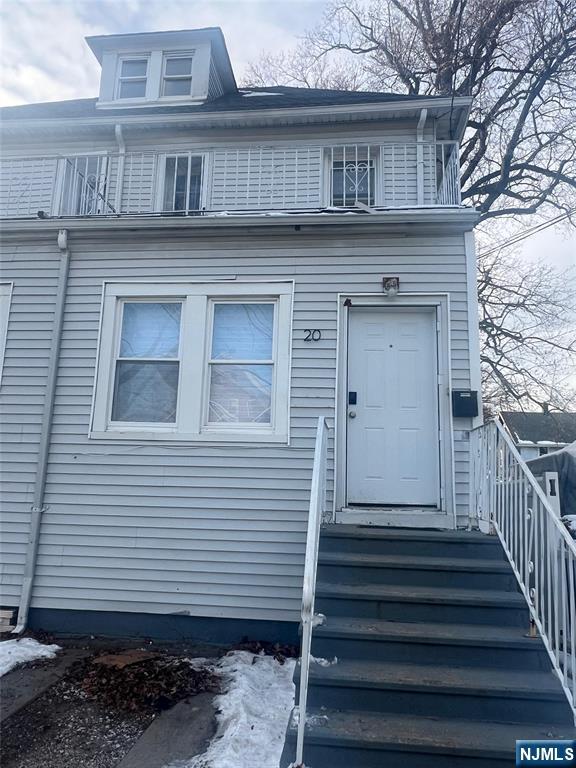 20 Maple Street Ridgefield Park, NJ 07660 - Photo 1 of 22 a front view of a house with a door