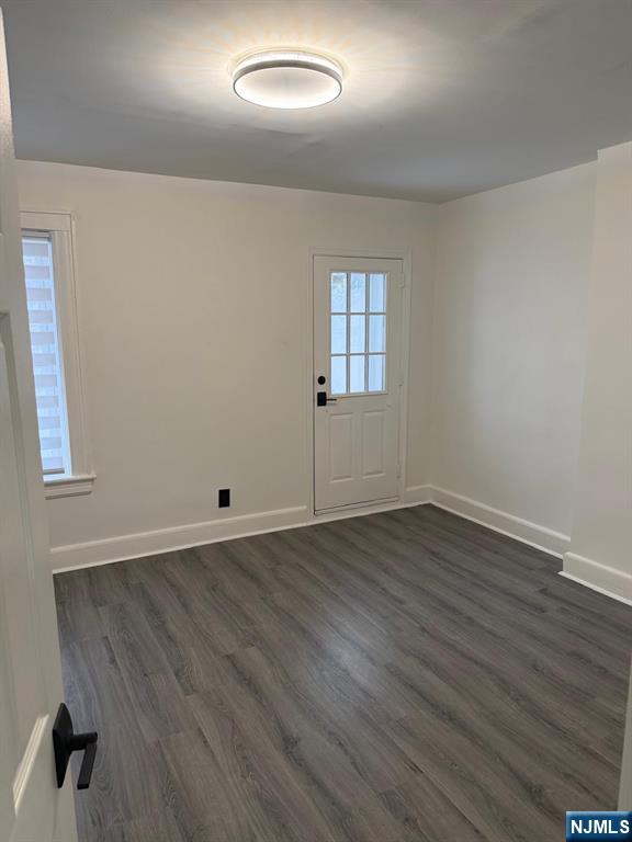 20 Maple Street Ridgefield Park, NJ 07660 - Photo 14 of 22 an empty room with wooden floor and windows