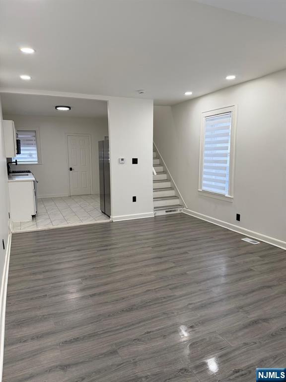 20 Maple Street Ridgefield Park, NJ 07660 - Photo 15 of 22 a view of an empty room with wooden floor and a window