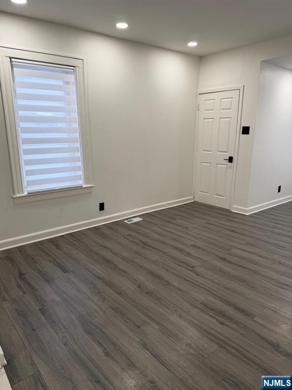 20 Maple Street Ridgefield Park, NJ 07660 - Photo 16 of 22 an empty room with wooden floor and windows