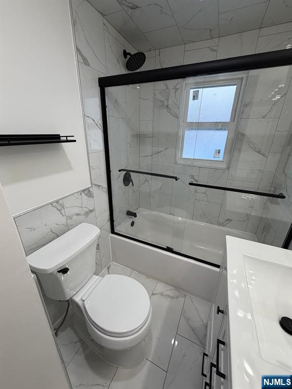 20 Maple Street Ridgefield Park, NJ 07660 - Photo 17 of 22 a bathroom with a toilet and a shower