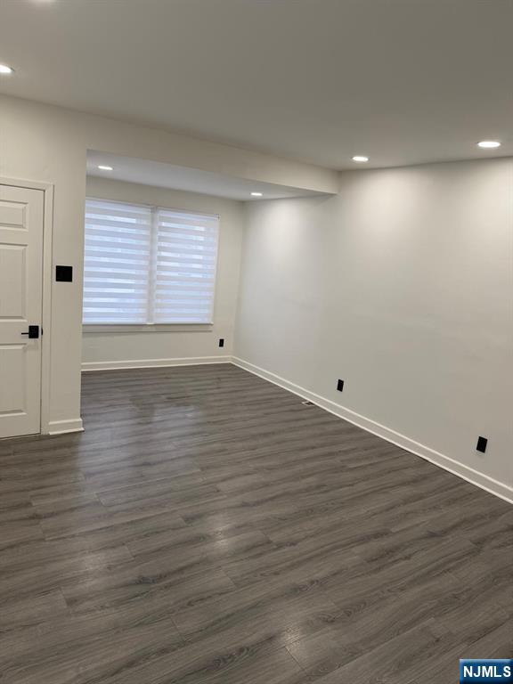 20 Maple Street Ridgefield Park, NJ 07660 - Photo 18 of 22 an empty room with wooden floor and windows