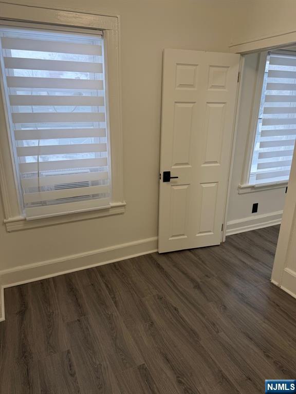 20 Maple Street Ridgefield Park, NJ 07660 - Photo 8 of 22 a view of an empty room with wooden floor and a window