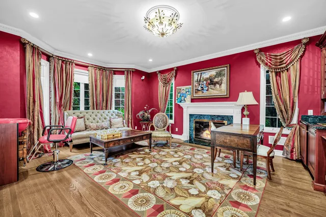 a living room with furniture a rug and a flat screen tv