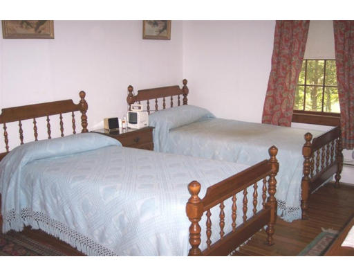 223 Middle Road Newbury, MA 01922 - Photo 8 of 10 a bedroom with furniture and a window
