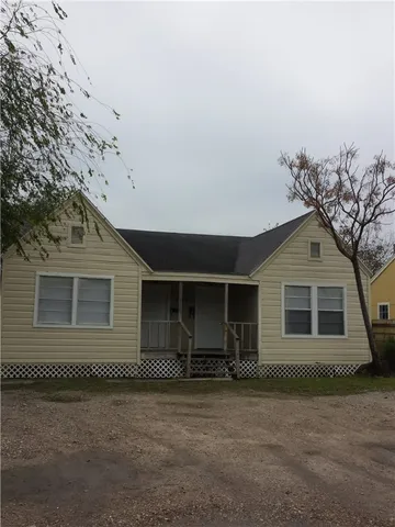 front view of a house with a dry yard