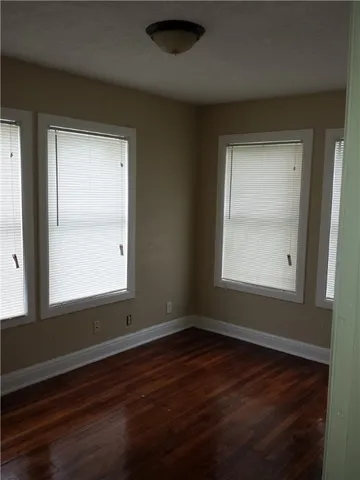 a white toilet sitting next to a bath tub