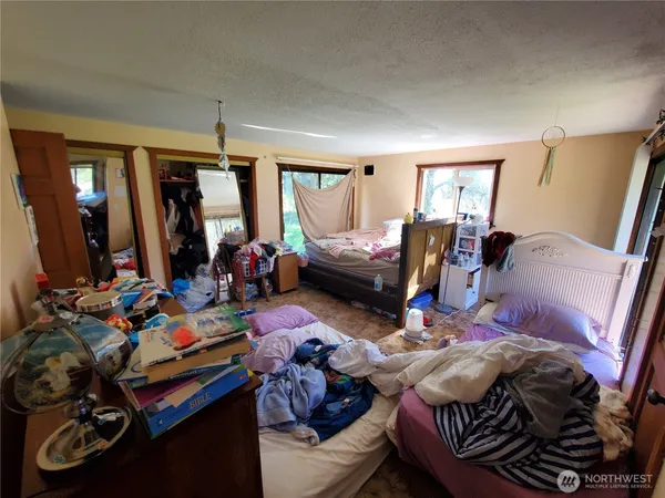 a bed room with furniture and a window