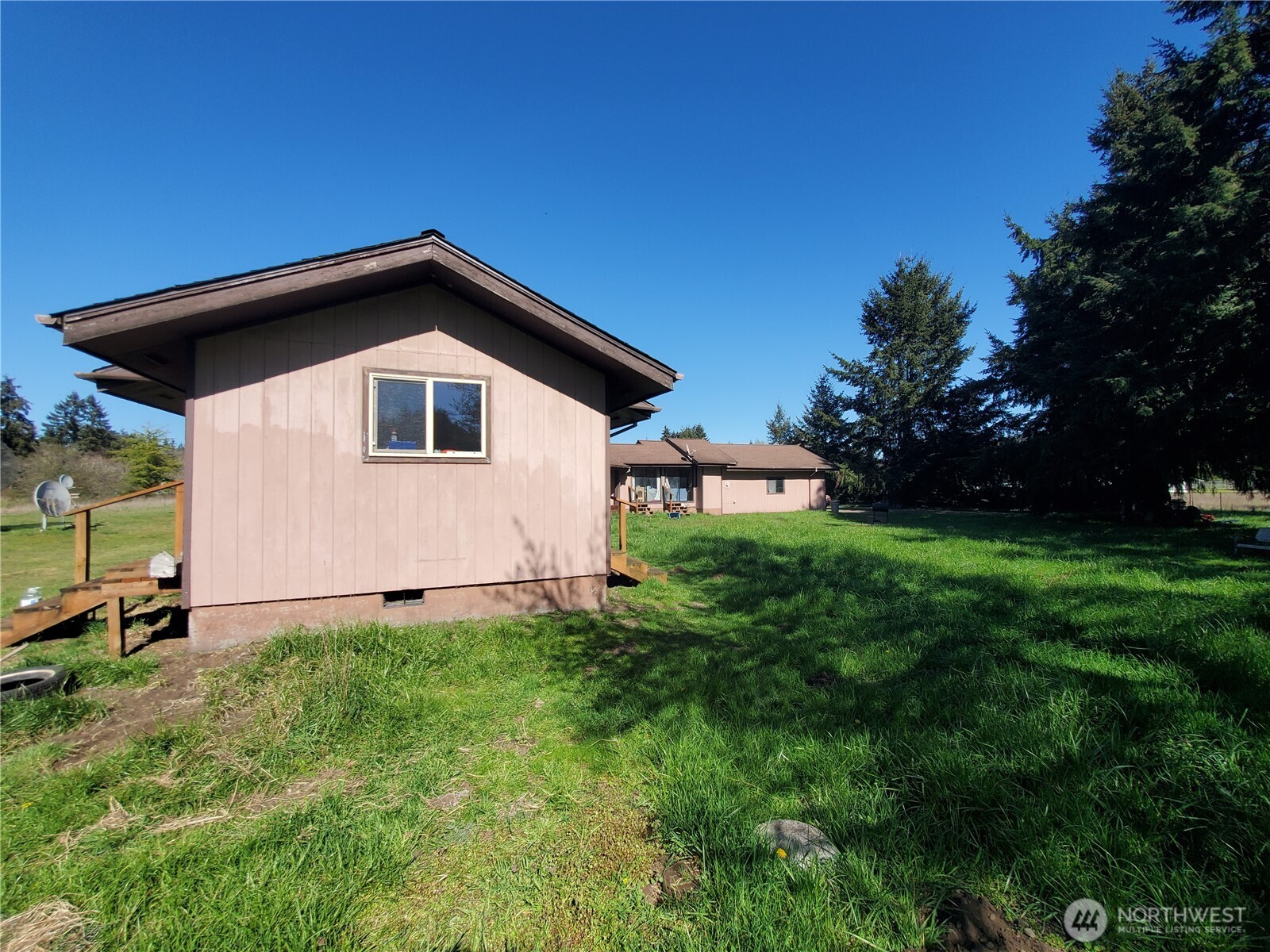 4924 165th Lane Southwest Rochester, WA 98579 - Photo 18 of 27 a front view of a house with garden