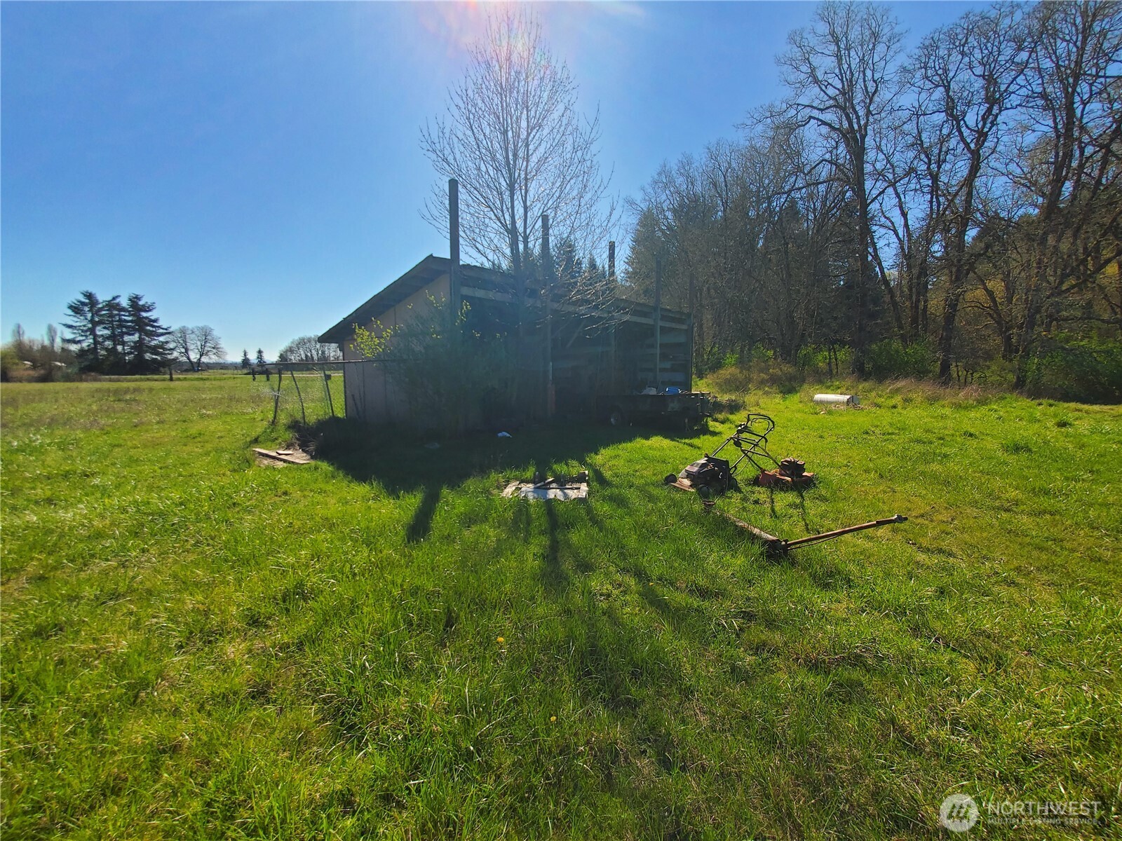 4924 165th Lane Southwest Rochester, WA 98579 - Photo 21 of 27 a backyard of a house with lots of green space