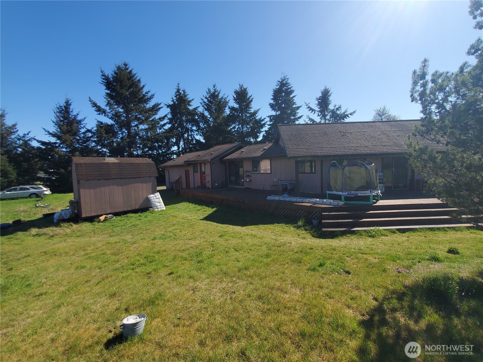 4924 165th Lane Southwest Rochester, WA 98579 - Photo 25 of 27 a view of a house with pool and a yard