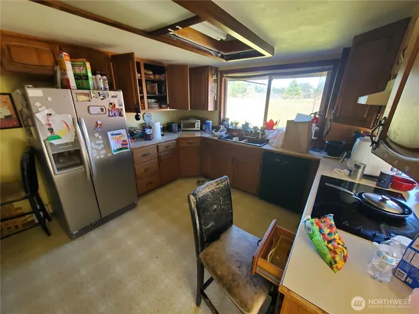 a room with furniture a flat screen tv and a window