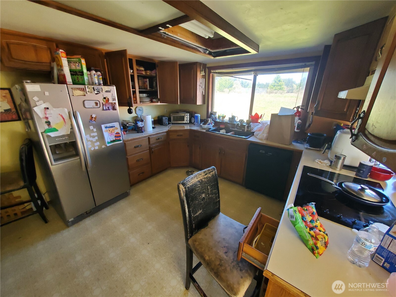 4924 165th Lane Southwest Rochester, WA 98579 - Photo 3 of 27 a room with furniture a flat screen tv and a window