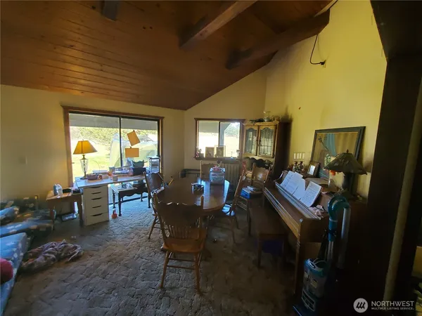a view of a dining room with furniture window and outside view