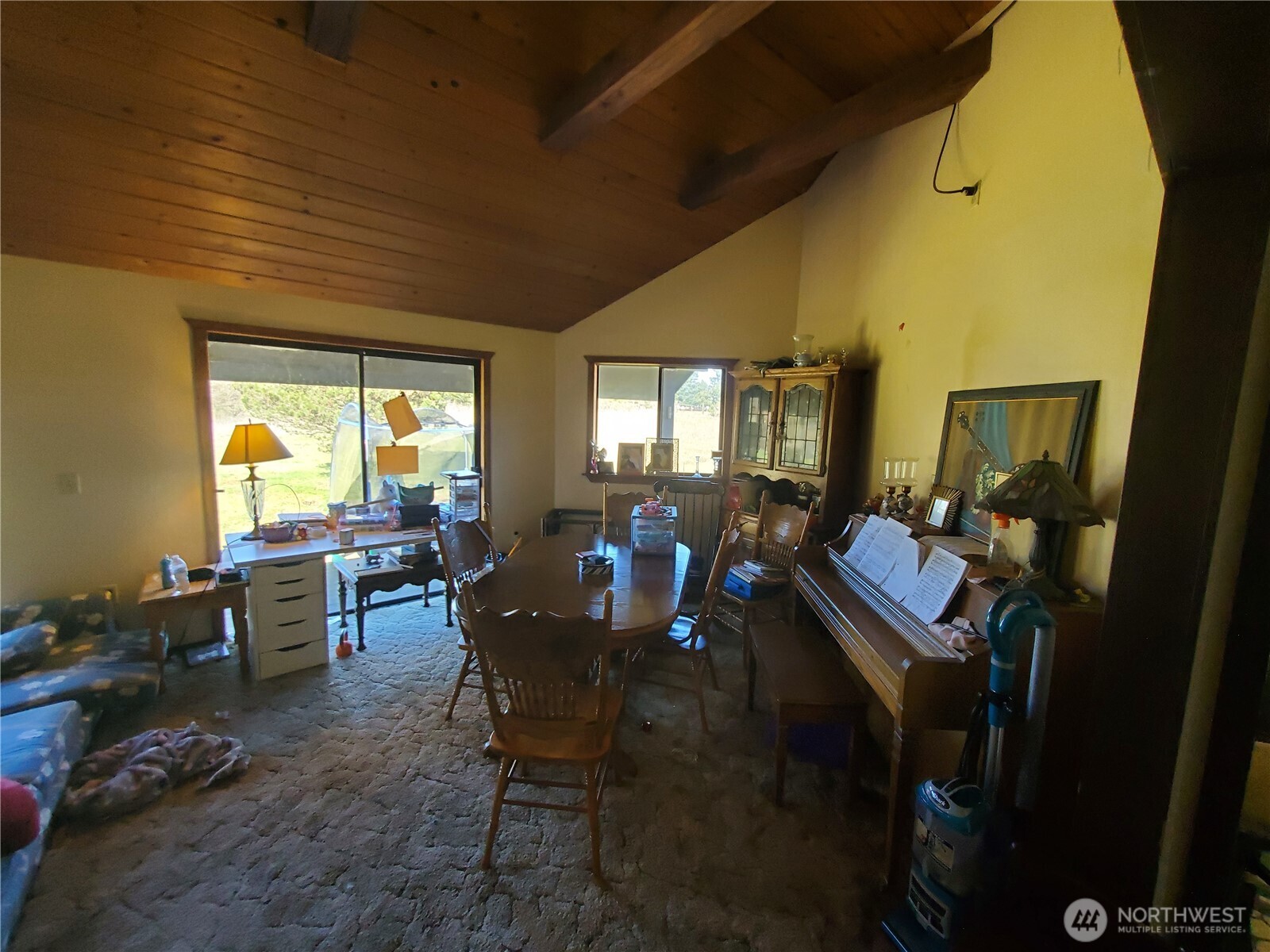 4924 165th Lane Southwest Rochester, WA 98579 - Photo 6 of 27 a view of a dining room with furniture window and outside view
