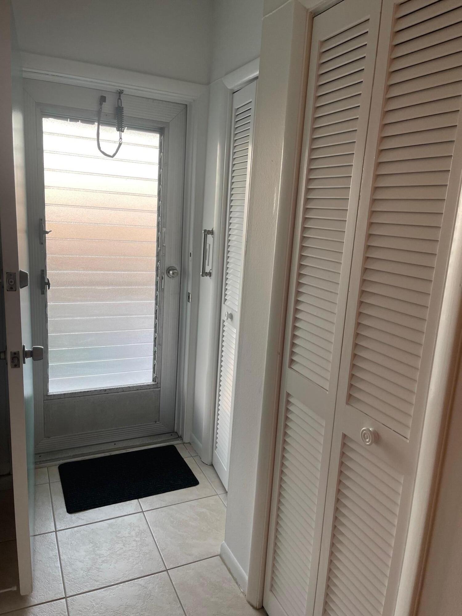 117 Lake Terrace, Unit F208 Boynton Beach, FL 33426 - Photo 13 of 30 a bathroom with a sink a toilet a window and vanity