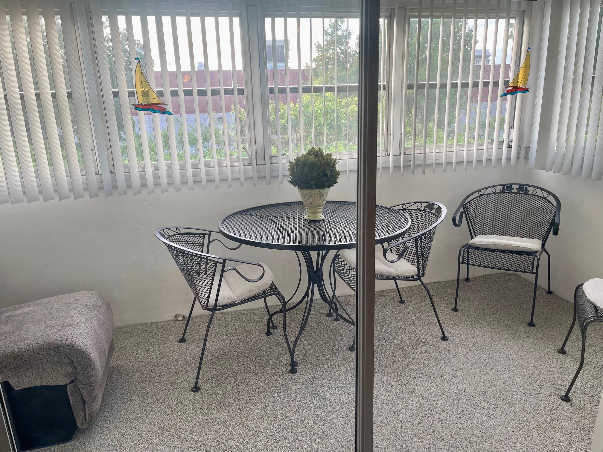 117 Lake Terrace, Unit F208 Boynton Beach, FL 33426 - Photo 14 of 30 a view of a livingroom with furniture and a window
