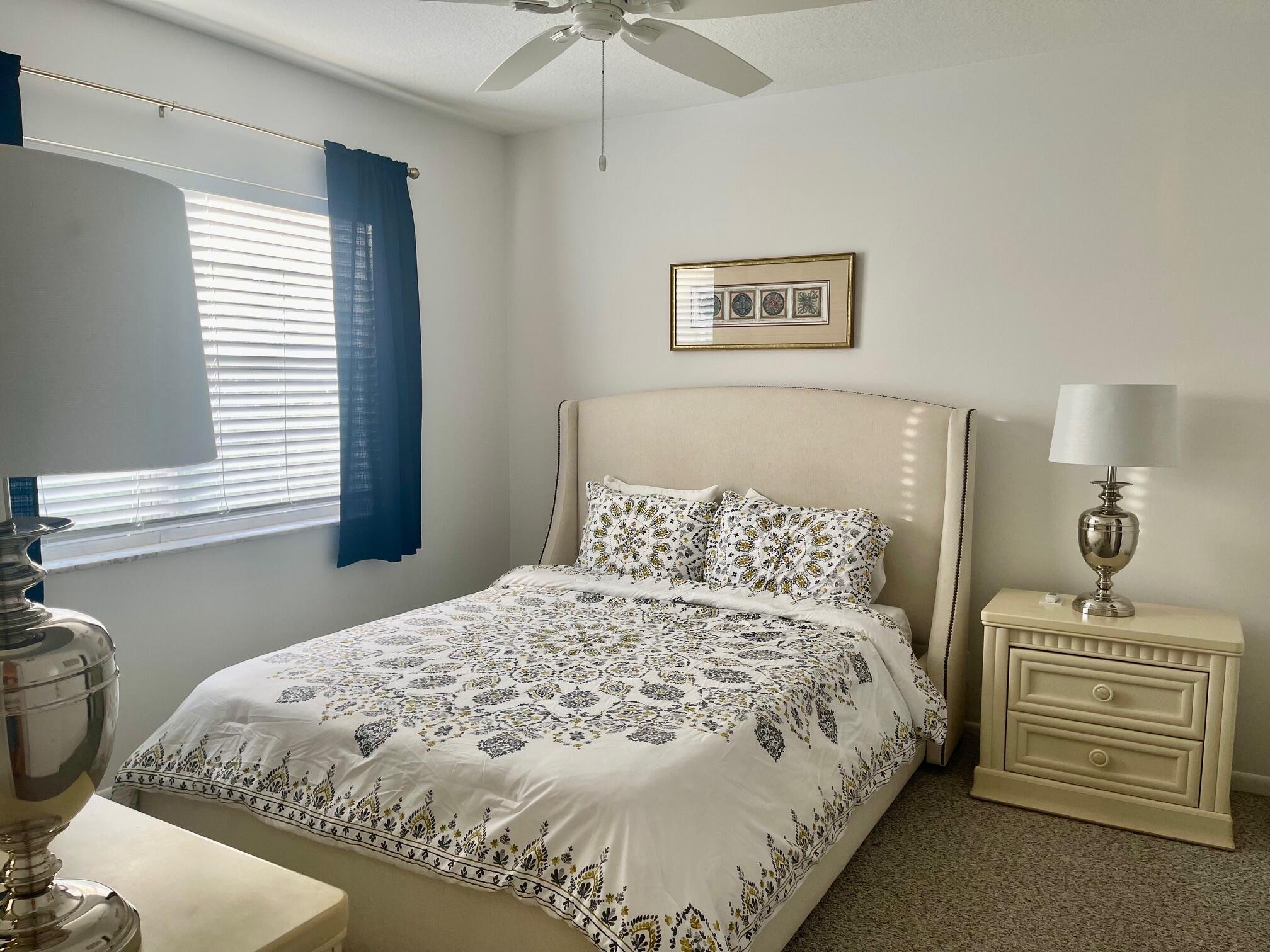 117 Lake Terrace, Unit F208 Boynton Beach, FL 33426 - Photo 15 of 30 a bedroom with a bed and a window