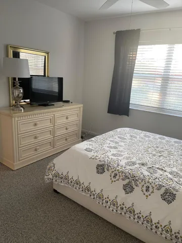 a view of room with furniture and wooden floor