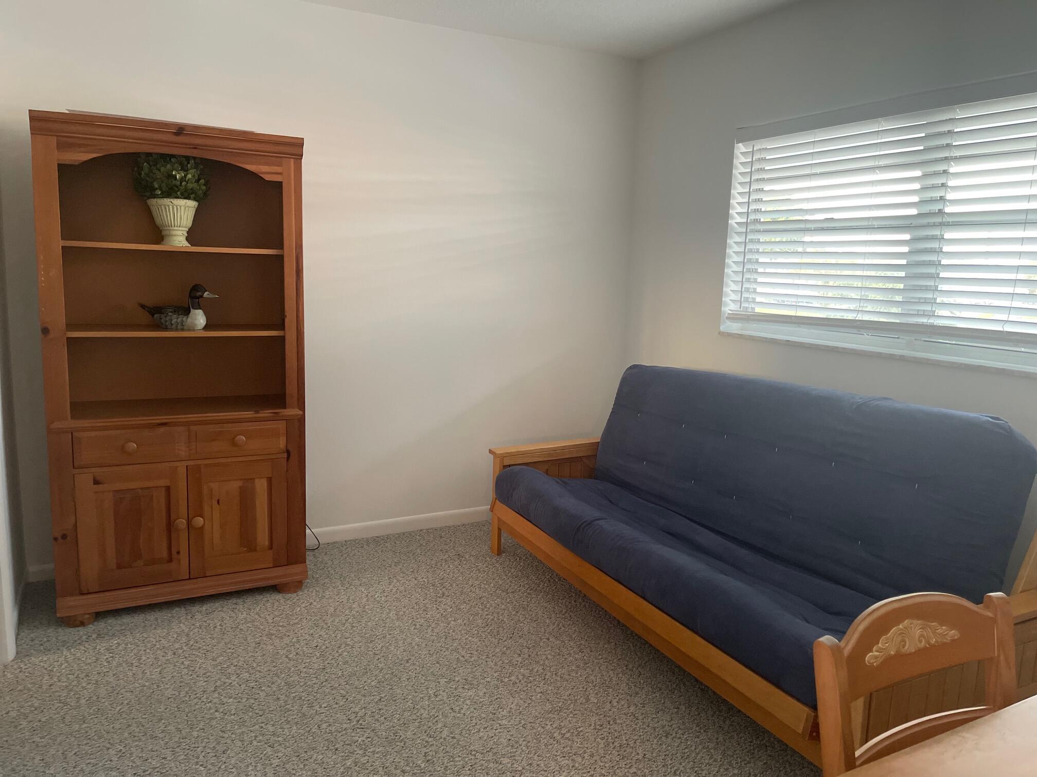 117 Lake Terrace, Unit F208 Boynton Beach, FL 33426 - Photo 22 of 30 a living room with furniture and a window