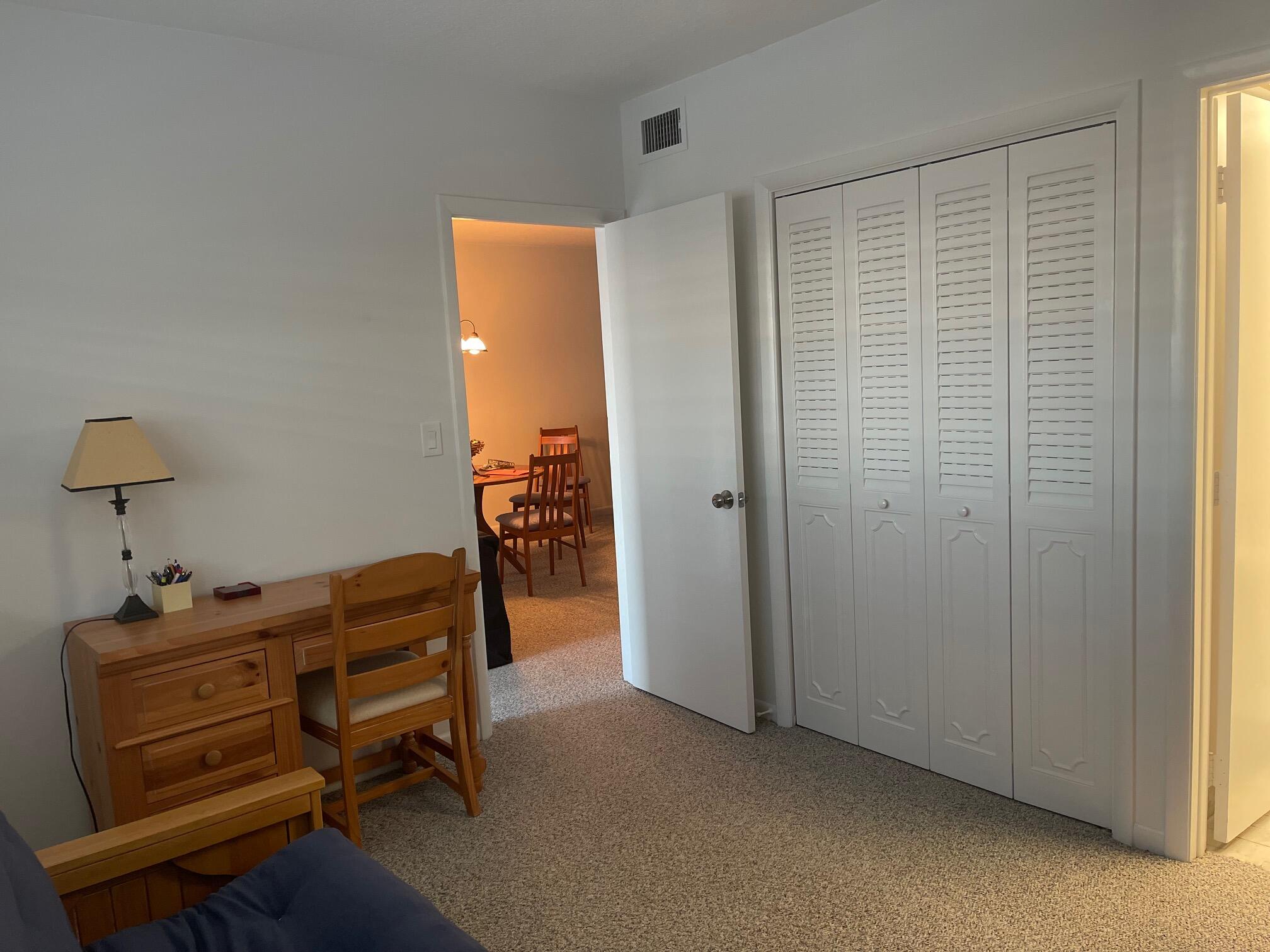 117 Lake Terrace, Unit F208 Boynton Beach, FL 33426 - Photo 23 of 30 a view of room with furniture and wooden floor