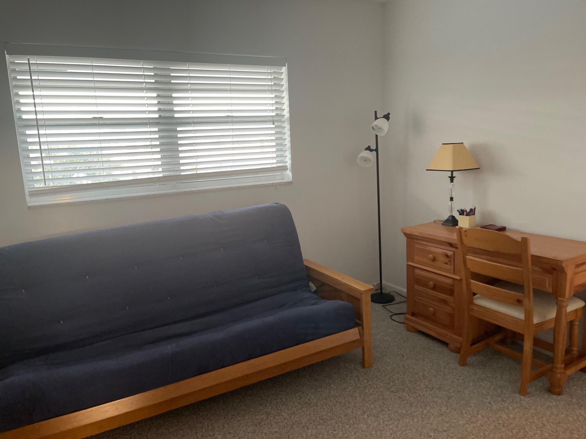 117 Lake Terrace, Unit F208 Boynton Beach, FL 33426 - Photo 24 of 30 a bedroom with a bed and a window