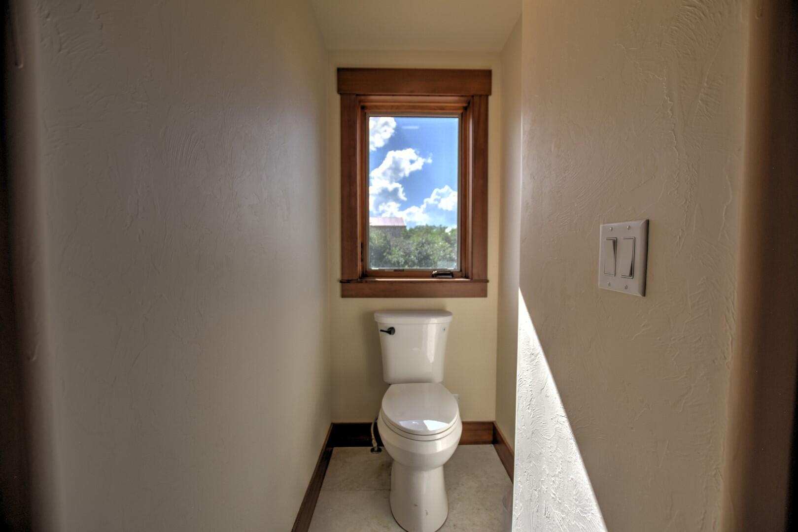 10 Valley View Road Ridgway, CO 81432 - Photo 13 of 33 a white toilet sitting next to a small window