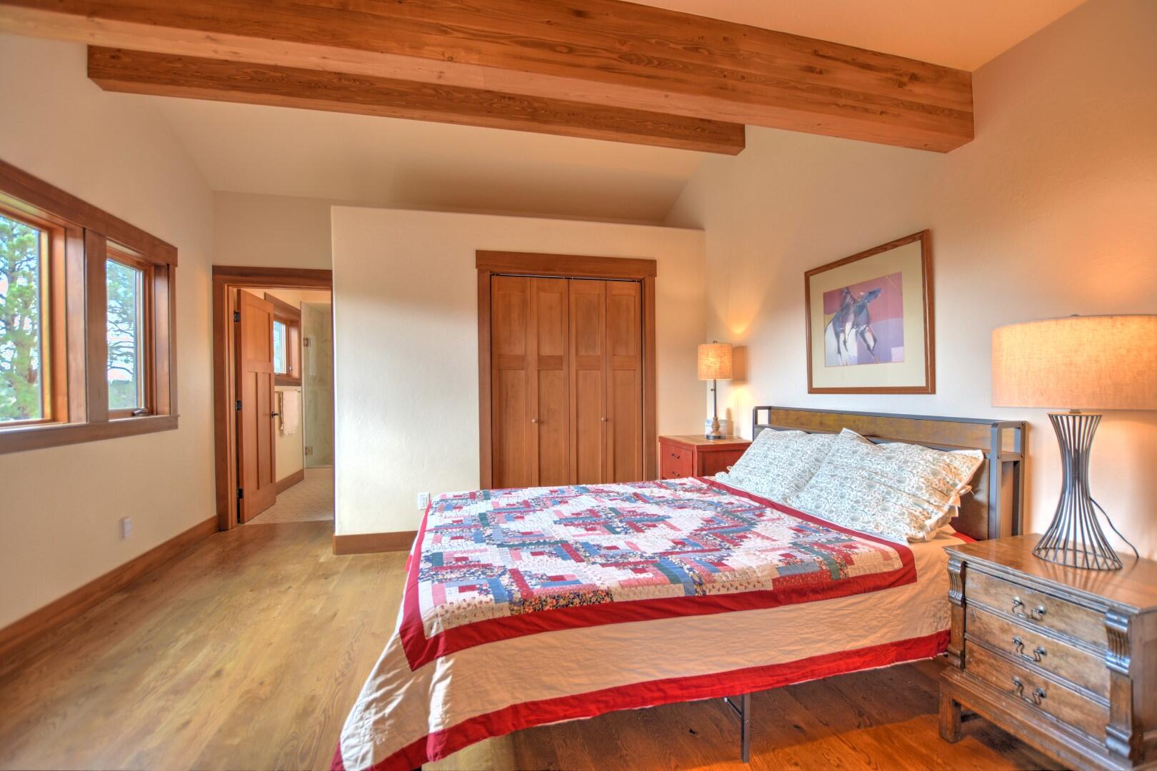 10 Valley View Road Ridgway, CO 81432 - Photo 16 of 33 a bedroom with a bed and a painting on the wall