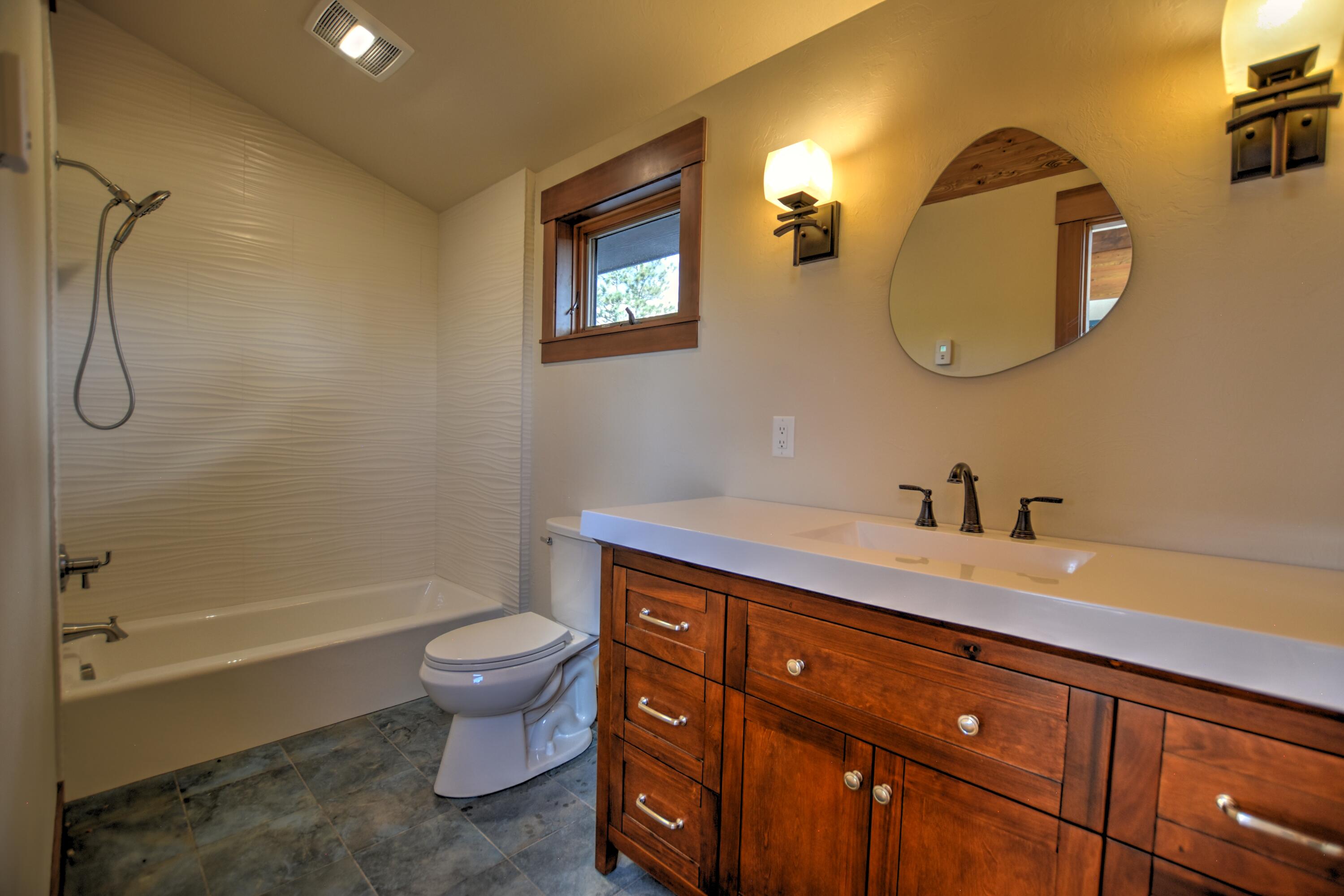 10 Valley View Road Ridgway, CO 81432 - Photo 20 of 33 a spacious bathroom with a toilet a sink and a mirror