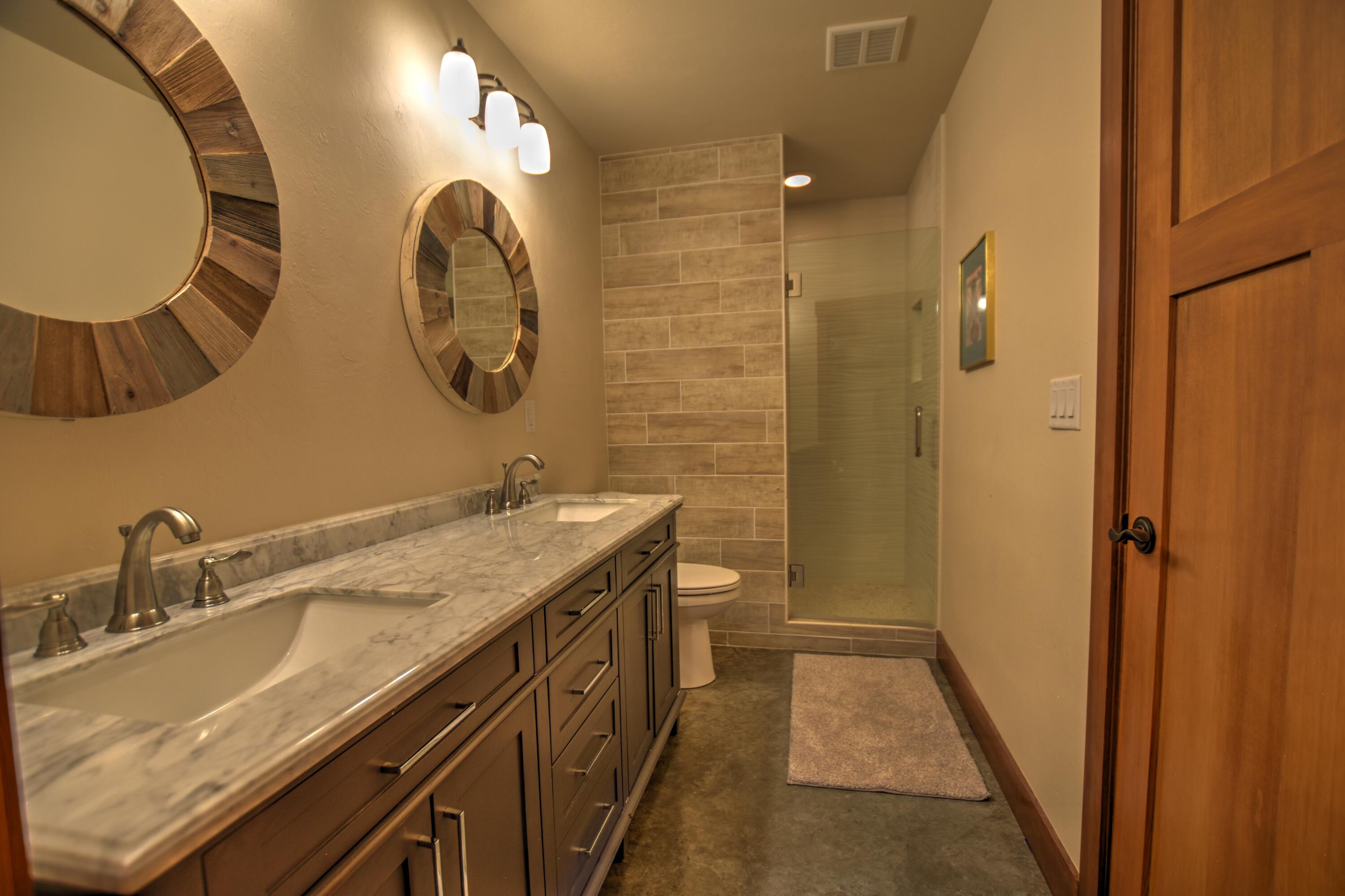 10 Valley View Road Ridgway, CO 81432 - Photo 23 of 33 a bathroom with a double vanity sink and a mirror