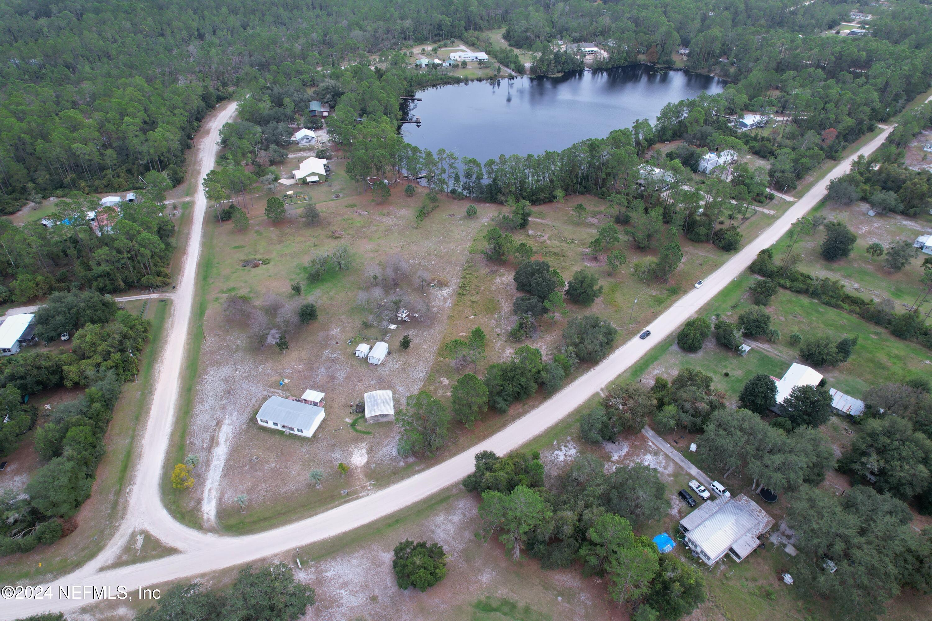 116 Osceola Road Georgetown, FL 32139 - Photo 4 of 19 an aerial view of a house a yard and lake
