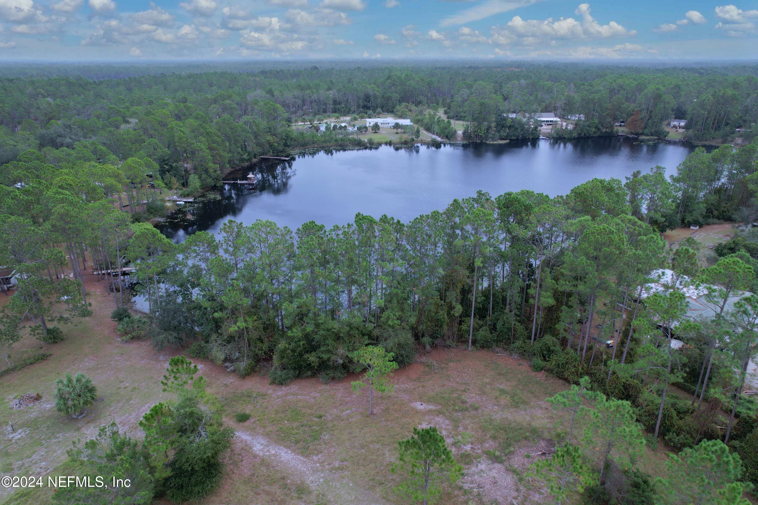 116 Osceola Road Georgetown, FL 32139 - Photo 9 of 19 a view of a lake with houses in back