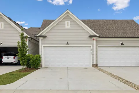 a front view of a house with a garage