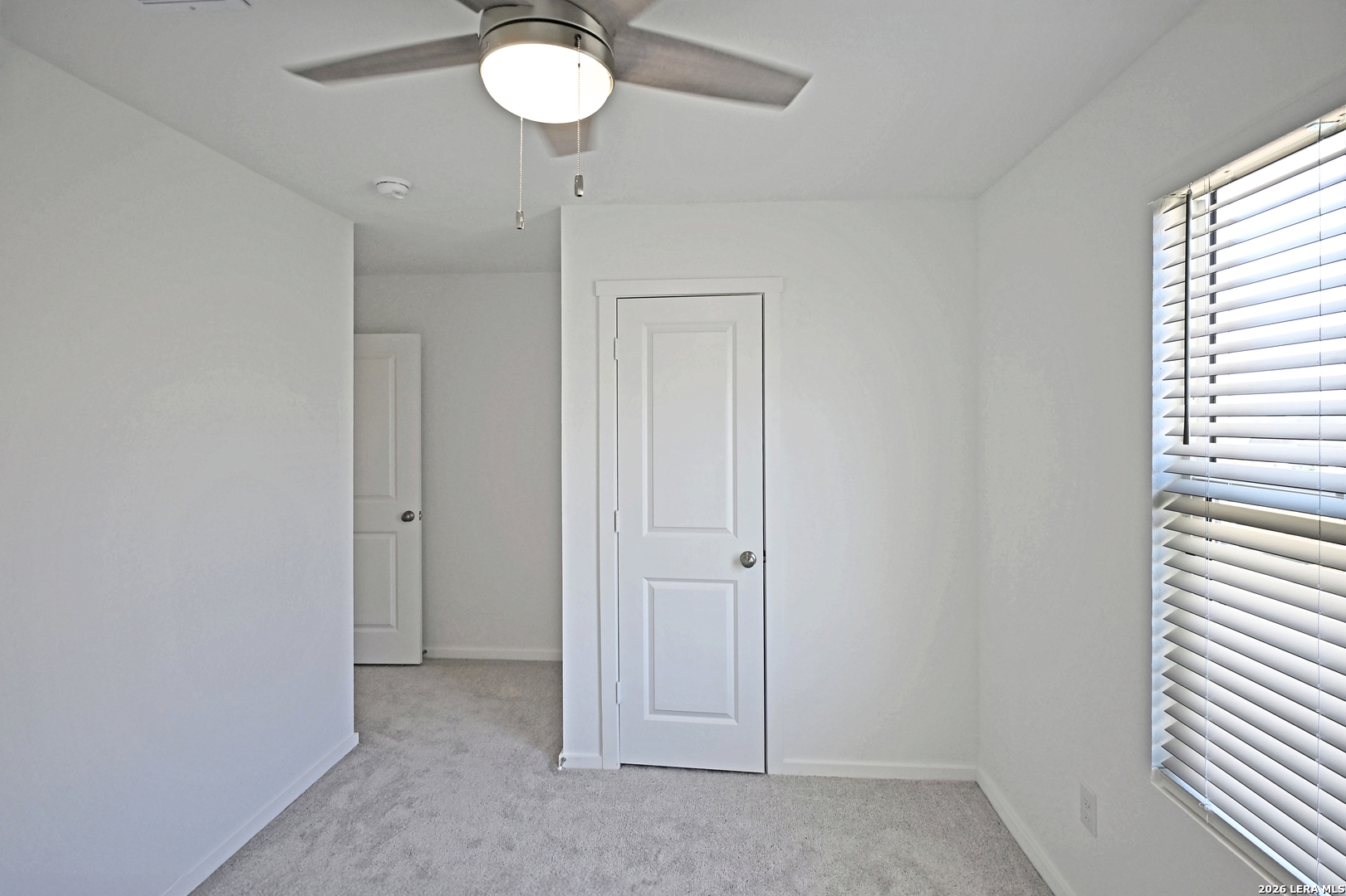 6730 Marble Ridge Elmendorf, TX 78112 - Photo 17 of 17 wooden floor in an empty room with a window