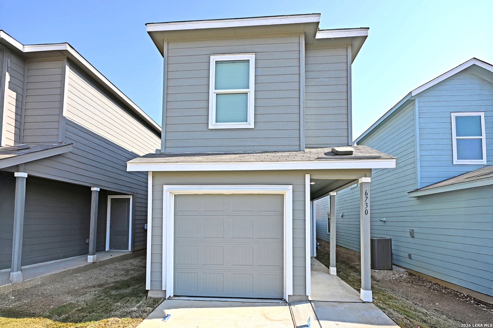 6730 Marble Ridge Elmendorf, TX 78112 - Photo 2 of 17 a front view of a house with garage