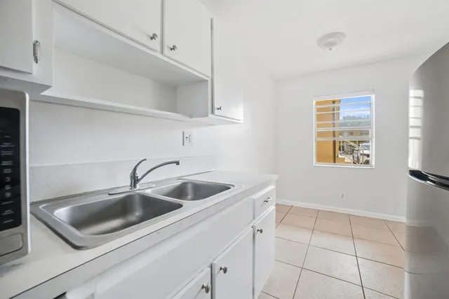 a sink and dishwasher with window