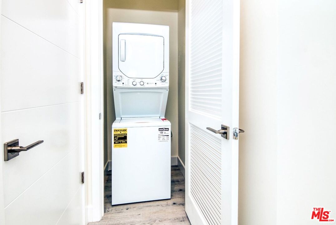 1237 South Holt Avenue, Unit 205 Los Angeles, CA 90035 - Photo 18 of 29 a utility room with dryer and washer