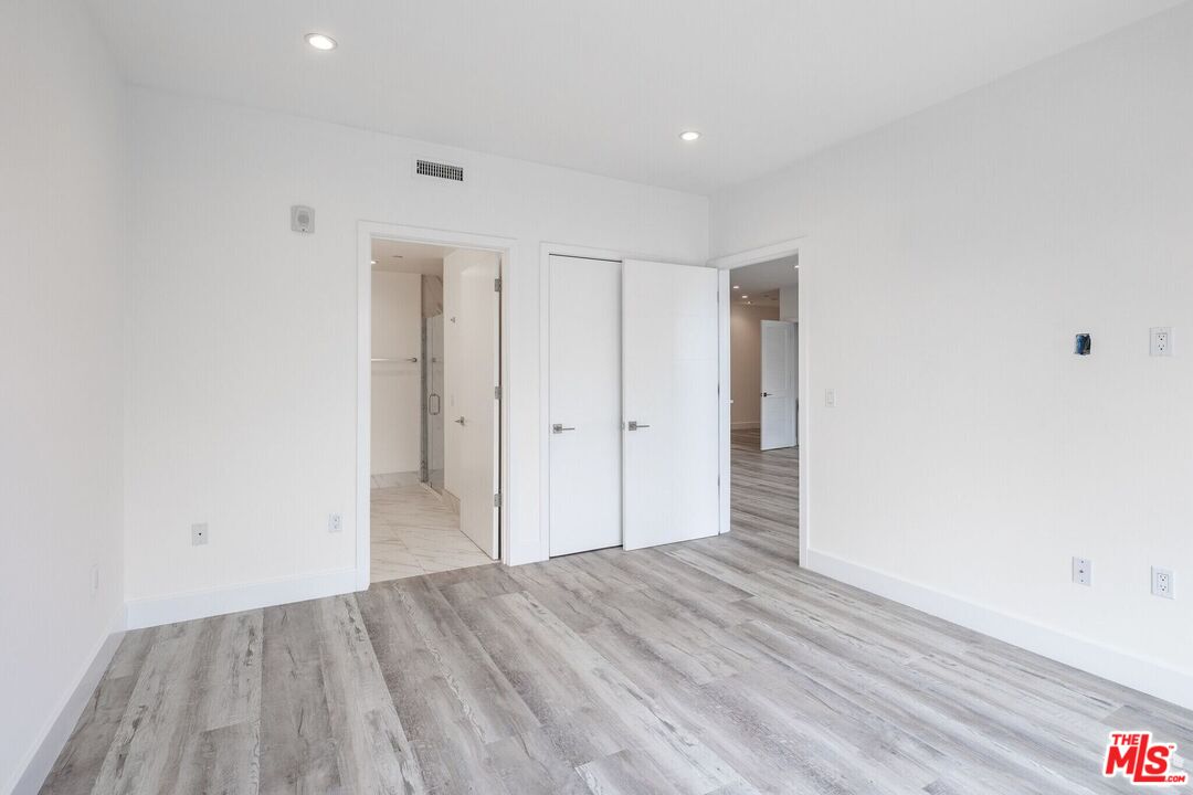 1237 South Holt Avenue, Unit 205 Los Angeles, CA 90035 - Photo 19 of 29 a view of hallway with wooden floor