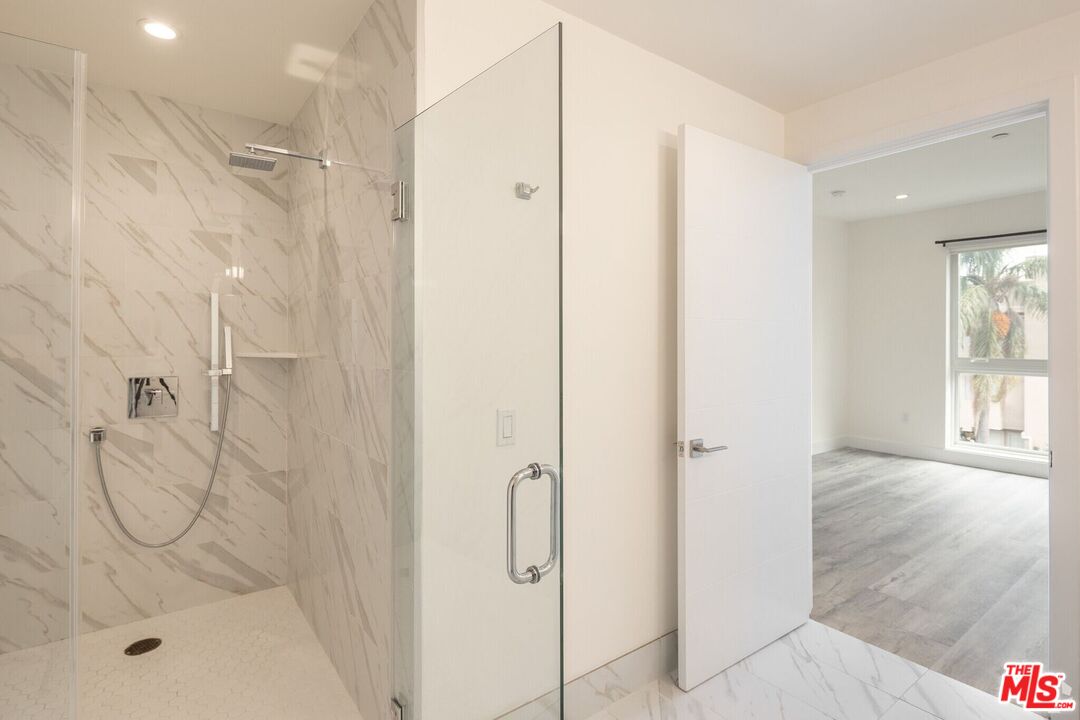 1237 South Holt Avenue, Unit 205 Los Angeles, CA 90035 - Photo 21 of 29 a bathroom with a shower