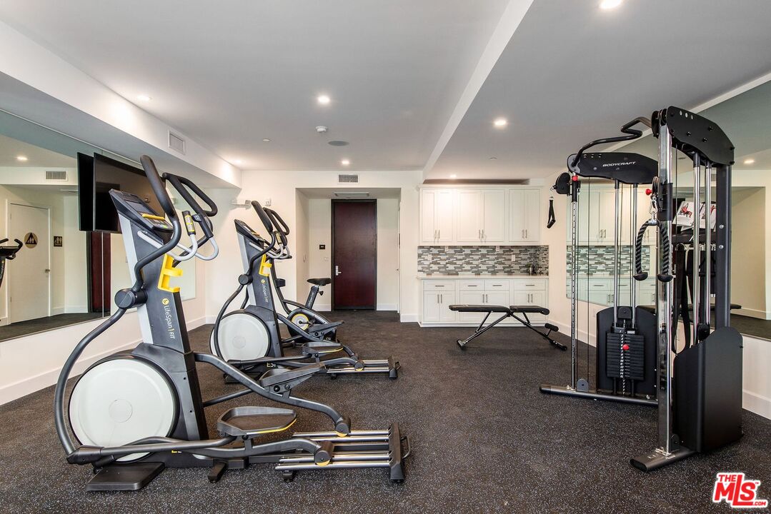 1237 South Holt Avenue, Unit 205 Los Angeles, CA 90035 - Photo 9 of 29 a view of a room with gym equipment