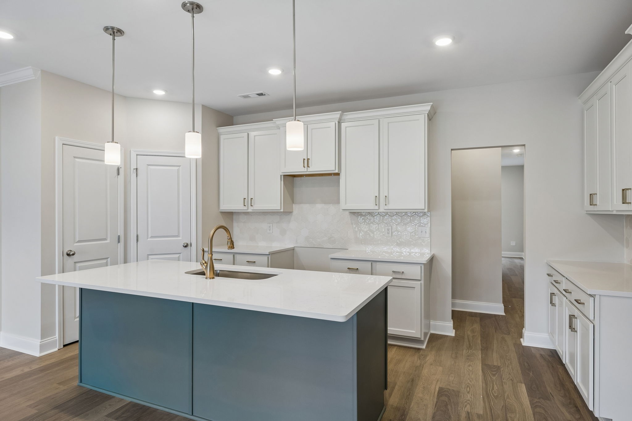 3215 Tasker Drive Antioch, TN 37013 - Photo 15 of 53 a kitchen with a sink a center island a stove and a refrigerator